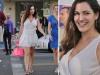 Kelly Brook flashed her tanned pins in a retro white minidress yesterday